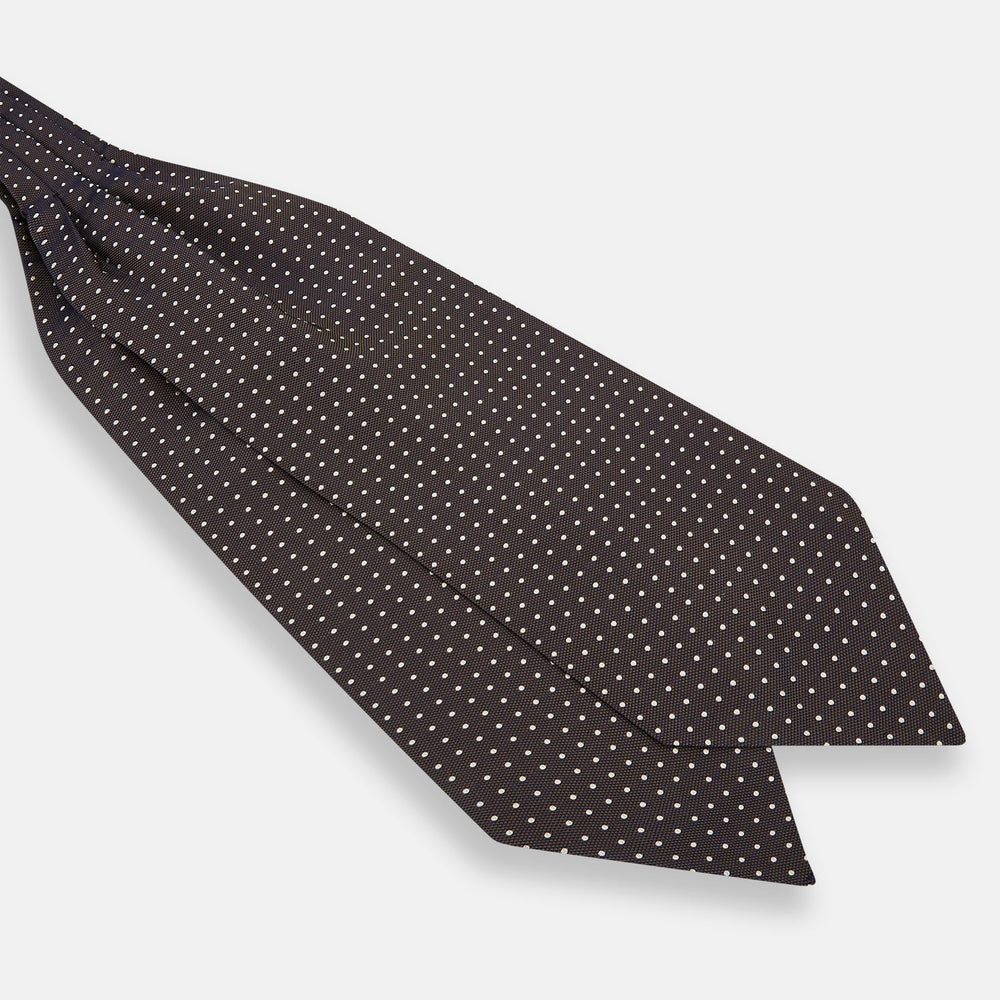 The White and Brown Micro Dot Silk Cravat from Turnbull & Asser adds refined style to any outfit with its subtle dotted pattern and luxurious silk fabric.