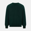 View 3 of product The Turnbull & Asser Forest Green Cashmere Cardigan—featuring long sleeves, a V-neck, button-down front, ribbed cuffs and hem, plus two front pockets—is shown against a plain white background.