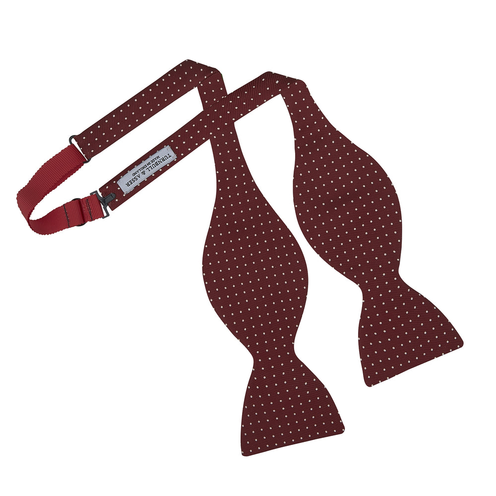 The Turnbull & Asser Burgundy and White Small Spot Printed Silk Bow Tie is shown on a plain white background.