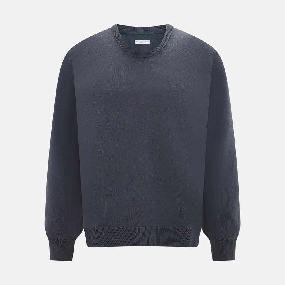 The Turnbull & Asser Grey Cashmere Round Neck Jumper is shown against a light gray background, featuring a relaxed fit with ribbed cuffs, collar, and hem for an elegant look.