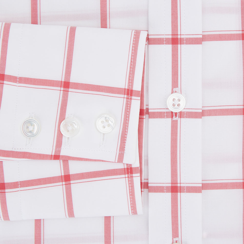 The Turnbull & Asser Coral Grid Check Mayfair Shirt is a white long-sleeve shirt with a collar, made from fine Italian cotton and featuring an evenly spaced coral grid check pattern.