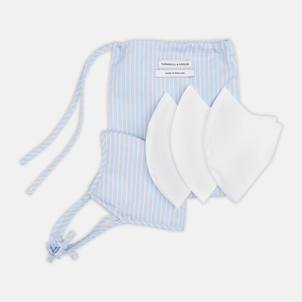 Turnbull & Asser's Exclusive Light Blue, White & Pink Stripe Commuter Mask features ear loops tied in bows and includes 3 VIROFORMULA™ filters for enhanced protection and comfort.