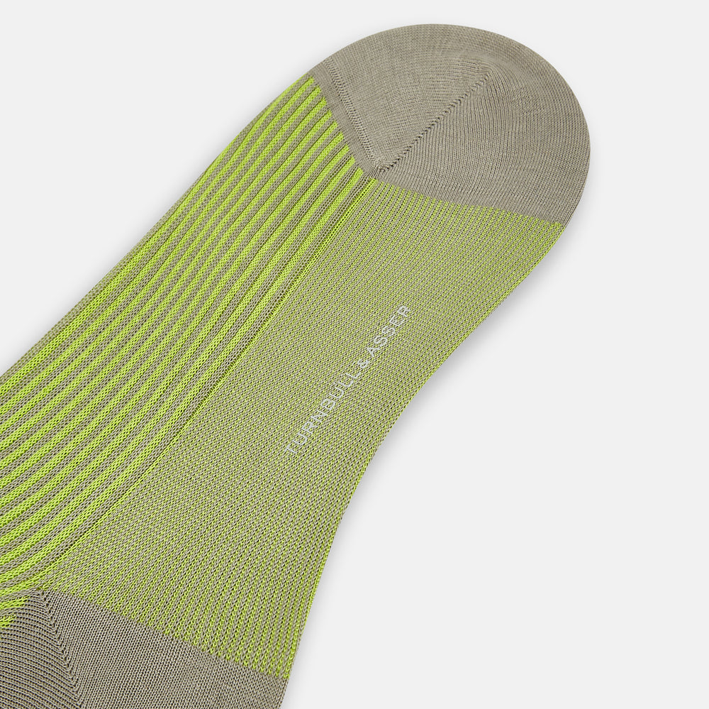 The Turnbull & Asser Lime/grey Thin Striped Long Socks are knee-high with green and yellow stripes and solid tan toe, heel, and cuff, shown against a plain light background.