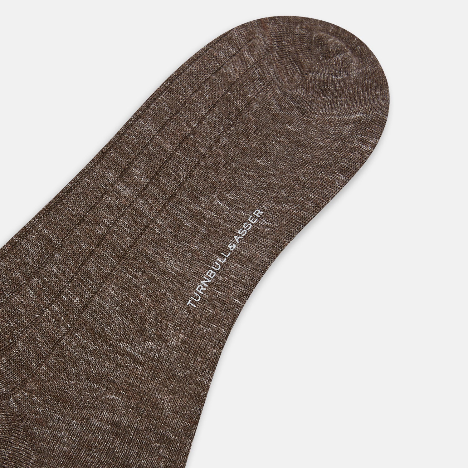 View 3 of product A single Dark Chocolate Linen Mid-Length Sock by Turnbull & Asser, ribbed and breathable, stands upright with its foot slightly raised against a plain white background.