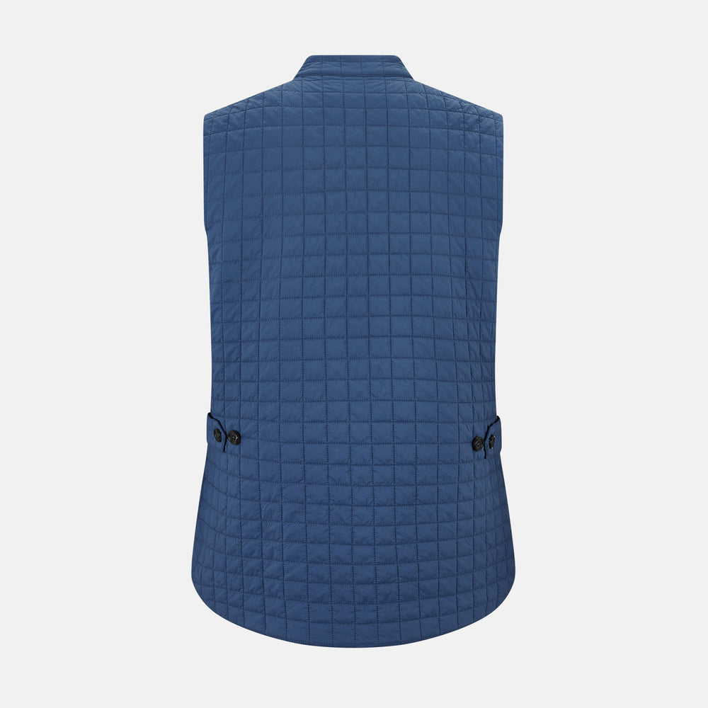 The Azzurro Double-Breasted Quilted Gilet by Turnbull & Asser is a sleeveless blue piece with black buttons, two zippered pockets, and a chest pocket—ideal for layered looks against a plain white background.
