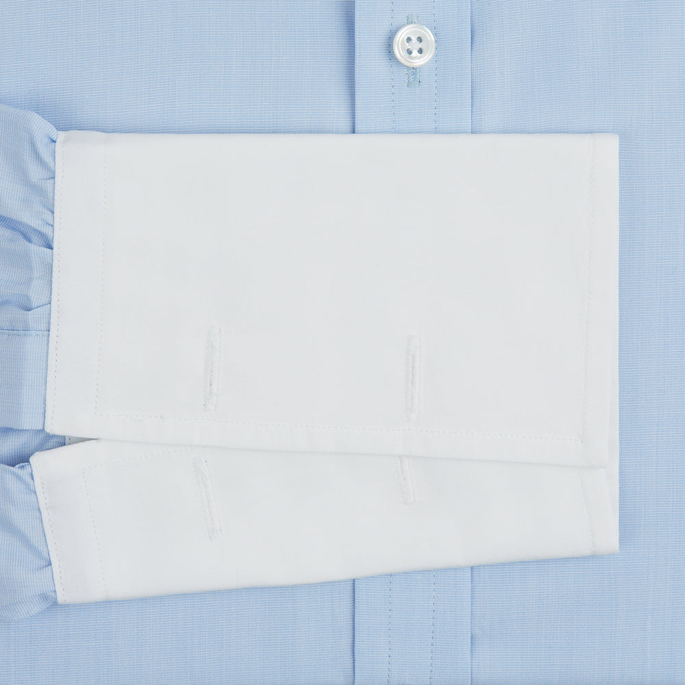 The Turnbull & Asser Light Blue End-on-End Shirt features a crisp white T&A contrast collar and double cuffs, shown flat on a white background.