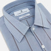 View 2 of product The Steel Blue Track Stripe Westminster Shirt by Turnbull & Asser features dark pinstripes, a classic collar, white buttons, and buttoned cuffs—expertly crafted to highlight British craftsmanship. Laid flat on white background.