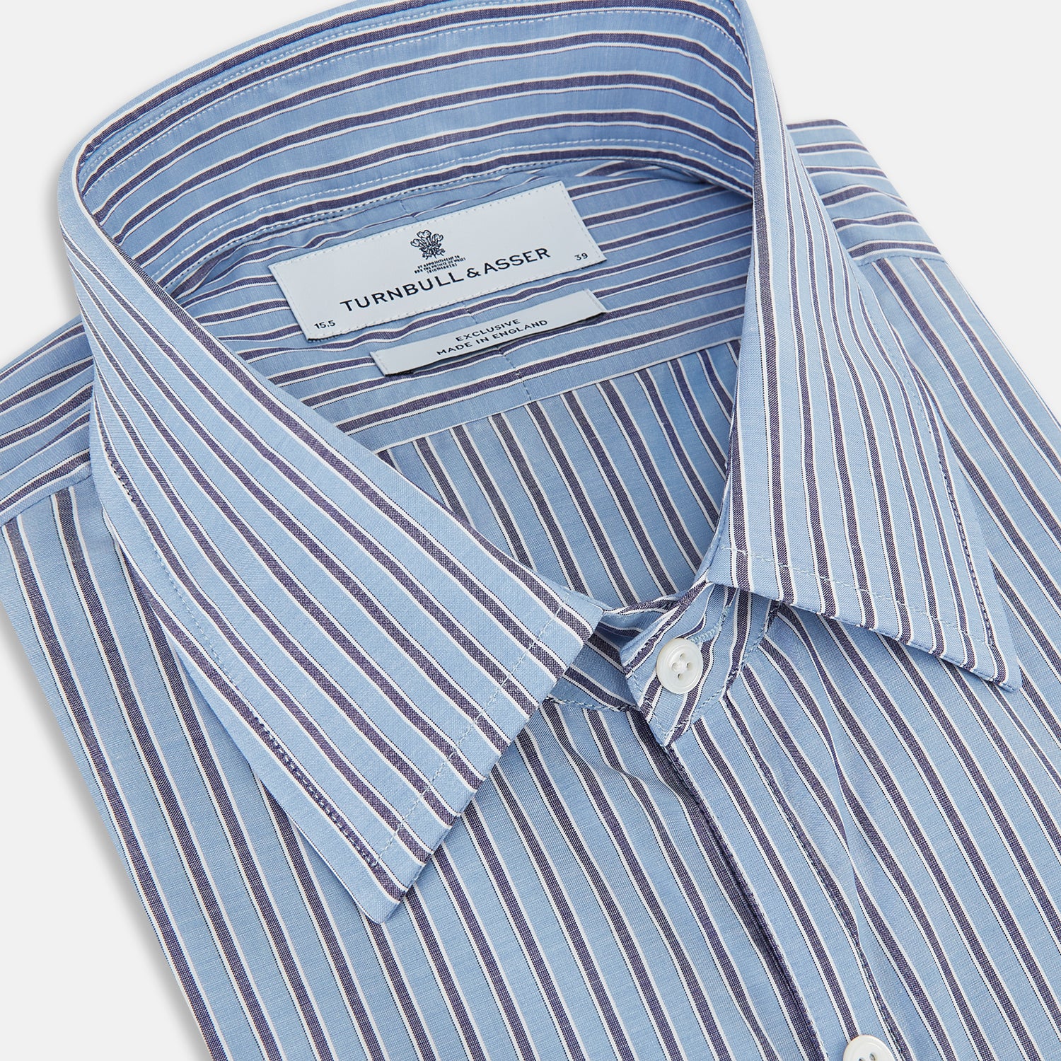 View 2 of product The Steel Blue Ticking Stripe Westminster Shirt by Turnbull & Asser features a classic fit, Turnbull collar, vertical stripes, white buttons, and buttoned cuffs—showcasing refined British craftsmanship.