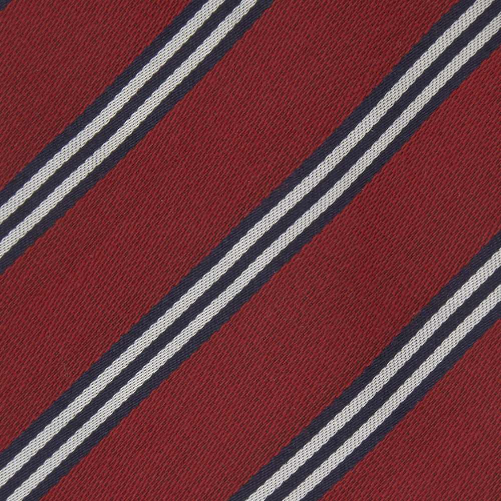 The Turnbull & Asser GGT92000 3042 48 OS is a rolled-up red cotton silk stripe tie with diagonal white and navy blue stripes, displayed on a plain white background.