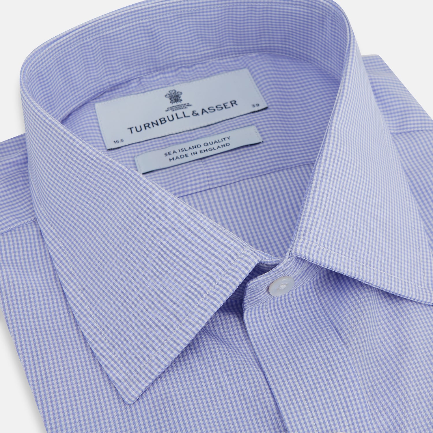 View 2 of product The Turnbull & Asser Blue Fine Check Sea Island Quality Cotton Shirt features a T&A collar, 3-button cuffs, and white buttons, shown on a plain white background.