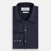 View 5 of product The Navy Linen Windsor Shirt by Turnbull & Asser features long sleeves, white buttons, a Turnbull collar, and buttoned cuffs in dark navy blue linen. Shown laid flat on a white background.