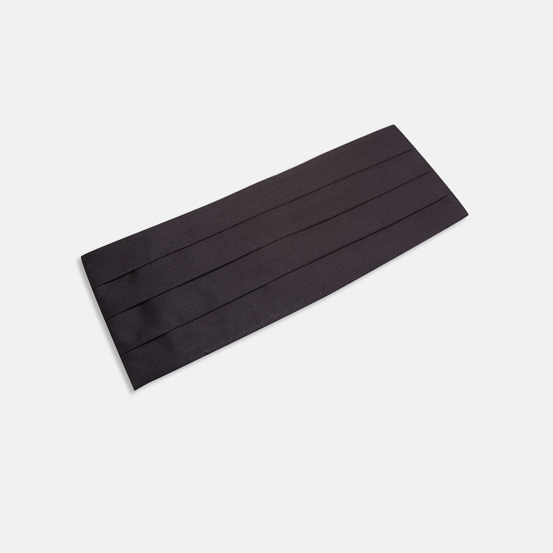 A Turnbull & Asser Black Satin Cummerbund with horizontal pleats is displayed flat against a white background.