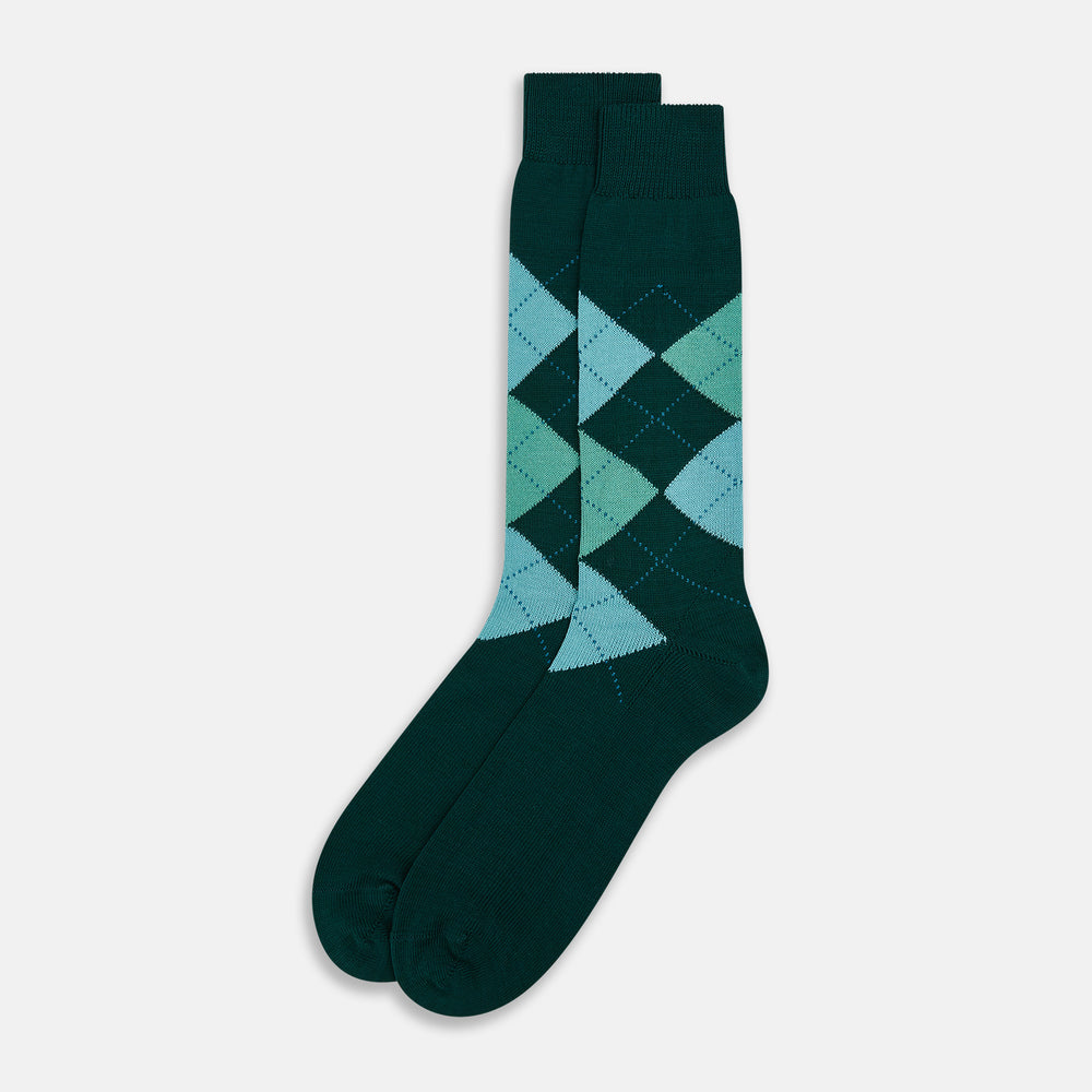 The Olive Check Mid-Length Socks by Turnbull & Asser, crafted from comfortable cotton in dark green with blue and light green argyle patterns, are shown on a plain white background—ideal for adding stylish flair to your sock collection.