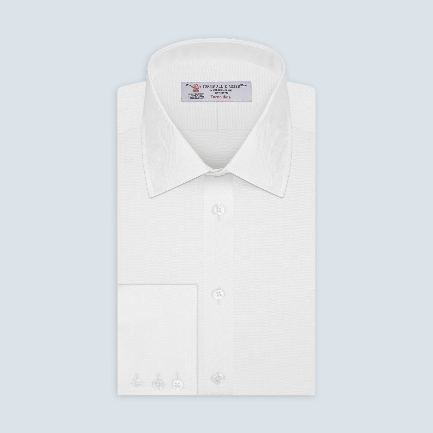 View 2 of product A circular area of Turnbull & Asser's White Herringbone Cotton Fabric, outlined with a thick gray border, appears against a plain light gray background.