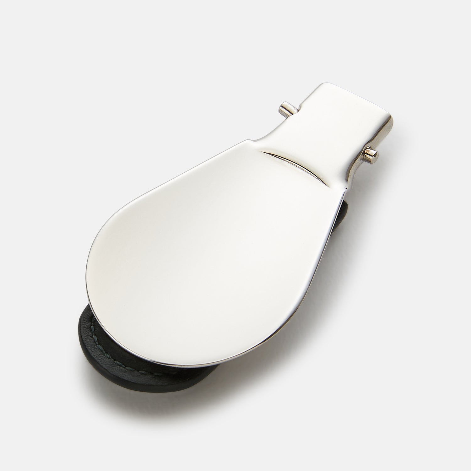 View 2 of product The Turnbull & Asser Forest Green Travel Shoe Horn features a wide, smooth metal blade and a forest green leather handle, shown against a plain white background.