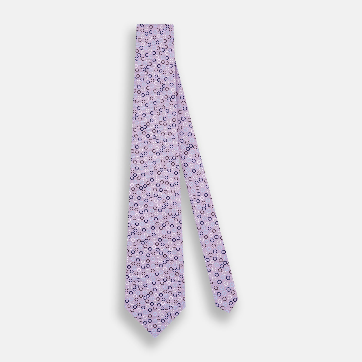 View 2 of product The Turnbull & Asser Multi-coloured Circle Lilac Silk Tie features overlapping blue, purple, and white circles on fine English silk—ideal for elevating smart outfits. Shown rolled against a plain white background.