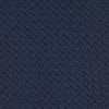 View 3 of product The Turnbull & Asser Navy Plain Woven Grenadine Silk Tie, an essential accessory, is rolled at one end and displayed on a plain white background.
