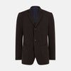 View 1 of product The Turnbull & Asser Dark Chocolate Knitted Cambridge Blazer for men, made from fine Italian wool with British tailoring, features a notched lapel, three front buttons, and three patch pockets, shown on a plain white background.