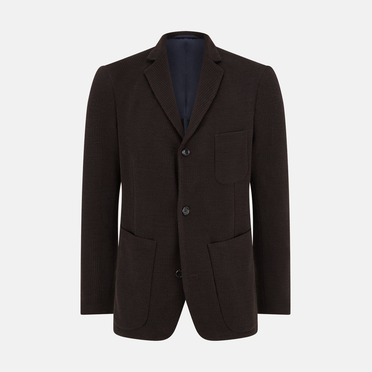 View 1 of product The Turnbull & Asser Dark Chocolate Knitted Cambridge Blazer for men, made from fine Italian wool with British tailoring, features a notched lapel, three front buttons, and three patch pockets, shown on a plain white background.
