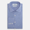 View 5 of product The Turnbull & Asser Blue Grid Check Belgravia Shirt, made from pure cotton with long sleeves, a spread collar, buttoned cuffs, and a blue-and-white check pattern, is laid flat on a white background.