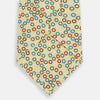View 3 of product The Turnbull & Asser Multi-coloured Circle Yellow Printed Silk Tie features vibrant blue, red, and black circles evenly spaced across luxurious English silk.