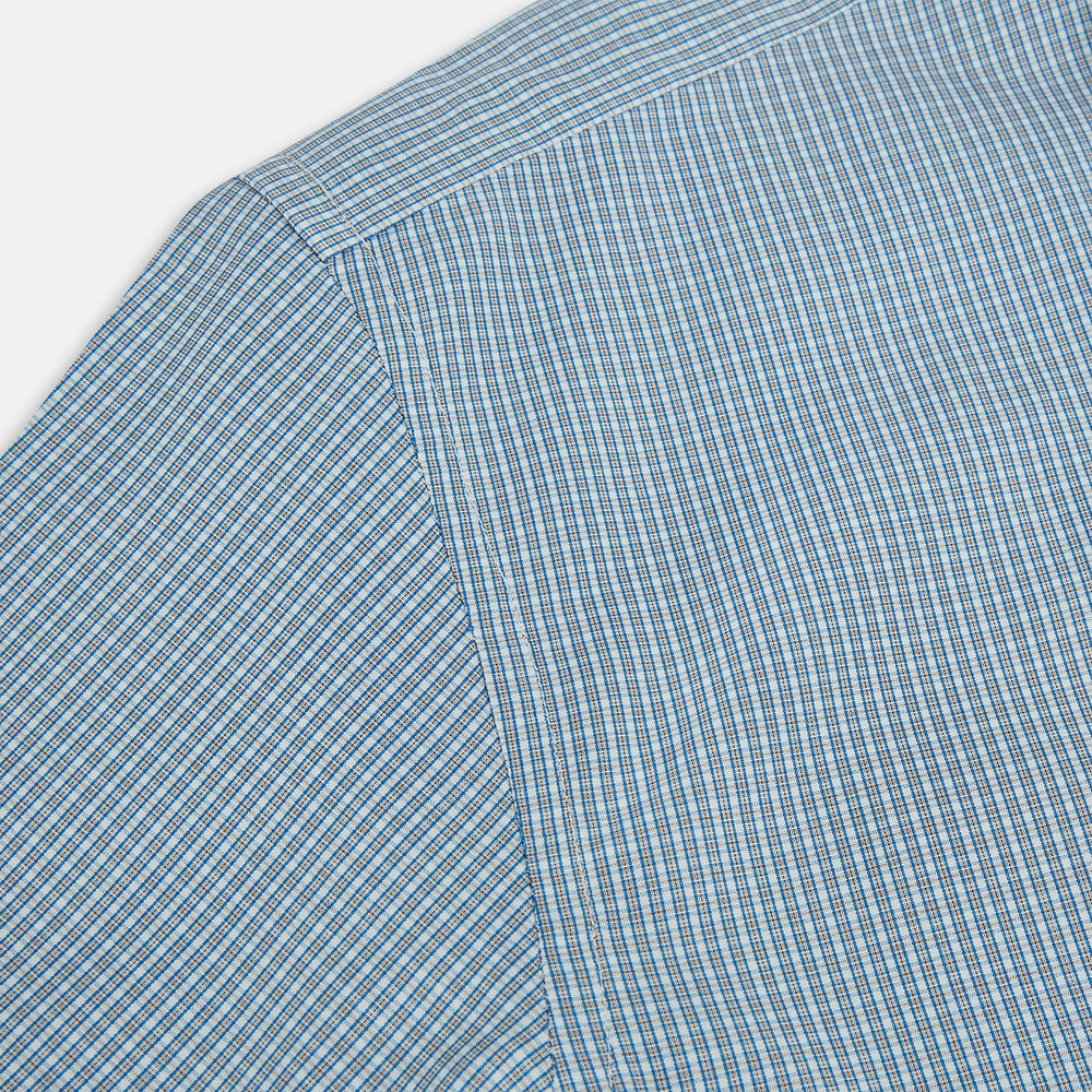 The Turnbull & Asser Blue and Brown Micro Shadow Check Westminster Shirt features a refined collar and white buttons, showcasing timeless British craftsmanship.