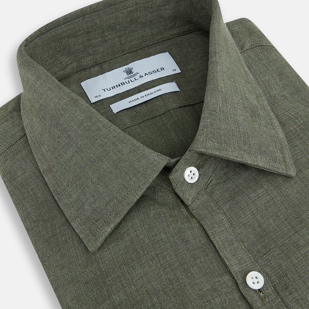 The Sage Linen Westminster Shirt by Turnbull & Asser features long sleeves, a button-up front with white buttons, a pointed Turnbull collar, and buttoned cuffs—crafted in Britain and shown here against a plain white background.