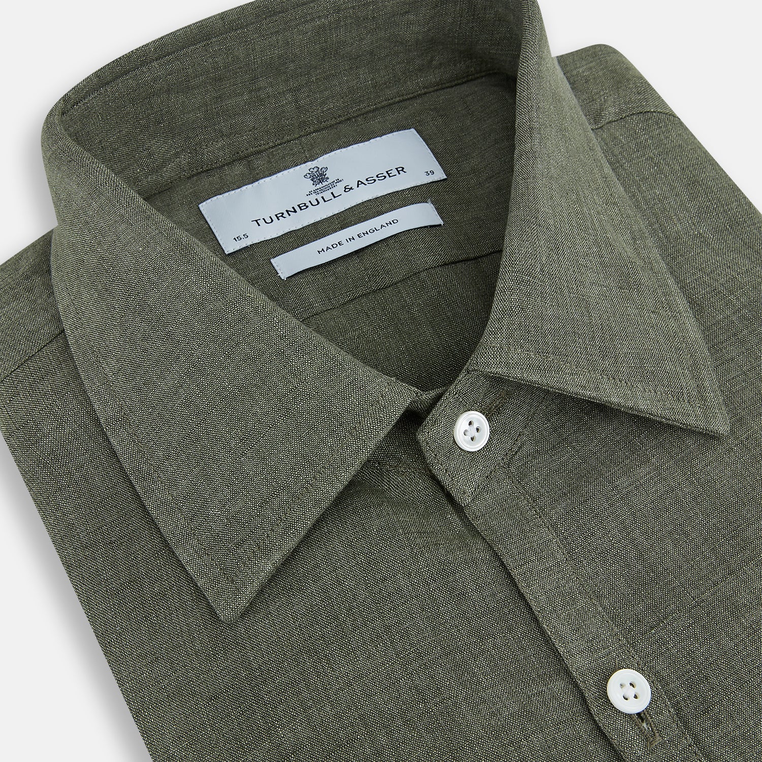 View 2 of product The Sage Linen Westminster Shirt by Turnbull & Asser features long sleeves, a button-up front with white buttons, a pointed Turnbull collar, and buttoned cuffs—crafted in Britain and shown here against a plain white background.
