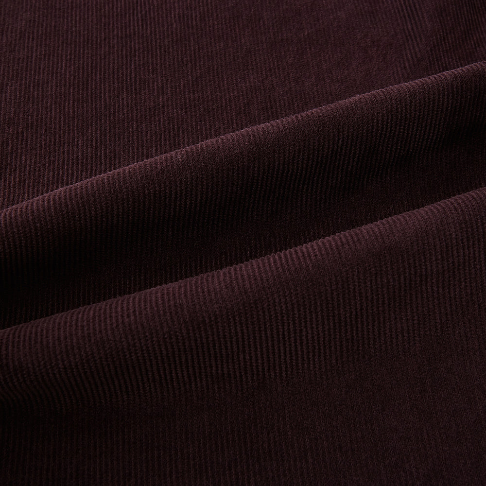 The Burgundy Kingston Corduroy Caban Jacket by Turnbull & Asser features black buttons, a notched collar, and front pockets. Crafted from premium cotton, it is shown on a plain white background.