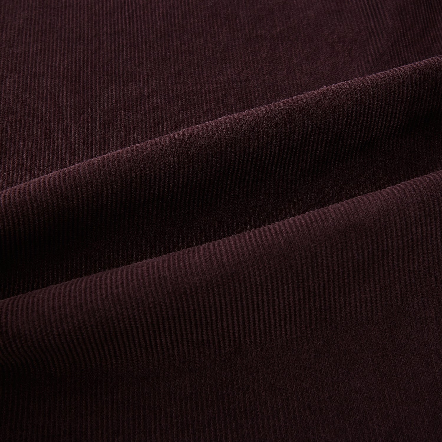 View 6 of product The Burgundy Kingston Corduroy Caban Jacket by Turnbull & Asser features black buttons, a notched collar, and front pockets. Crafted from premium cotton, it is shown on a plain white background.
