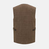 View 3 of product The Turnbull & Asser Pine Cone Quilted Linen Herringbone Waistcoat features a brown, sleeveless design with dark buttons, two angled side pockets, and a chest pocket, shown on a plain white background.
