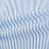 View 6 of product The Turnbull & Asser Pale Blue Pinstripe Mayfair Shirt features pale blue pinstripes, a classic T&A collar, white buttons, and cuffed sleeves, shown against a plain white background.