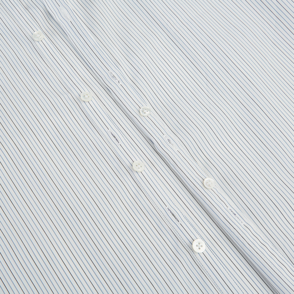 The Turnbull & Asser Grey and Blue Pinstripe Westminster Shirt features fine stripes, a classic collar, and buttoned cuffs—showcasing signature British craftsmanship against a plain white backdrop.