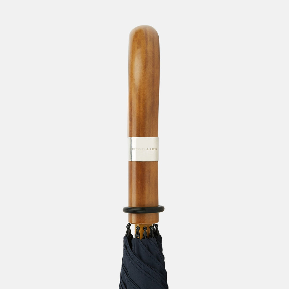 The Turnbull & Asser Navy Traveller Umbrella features a Malacca crook handle and is shown open against a plain white background.
