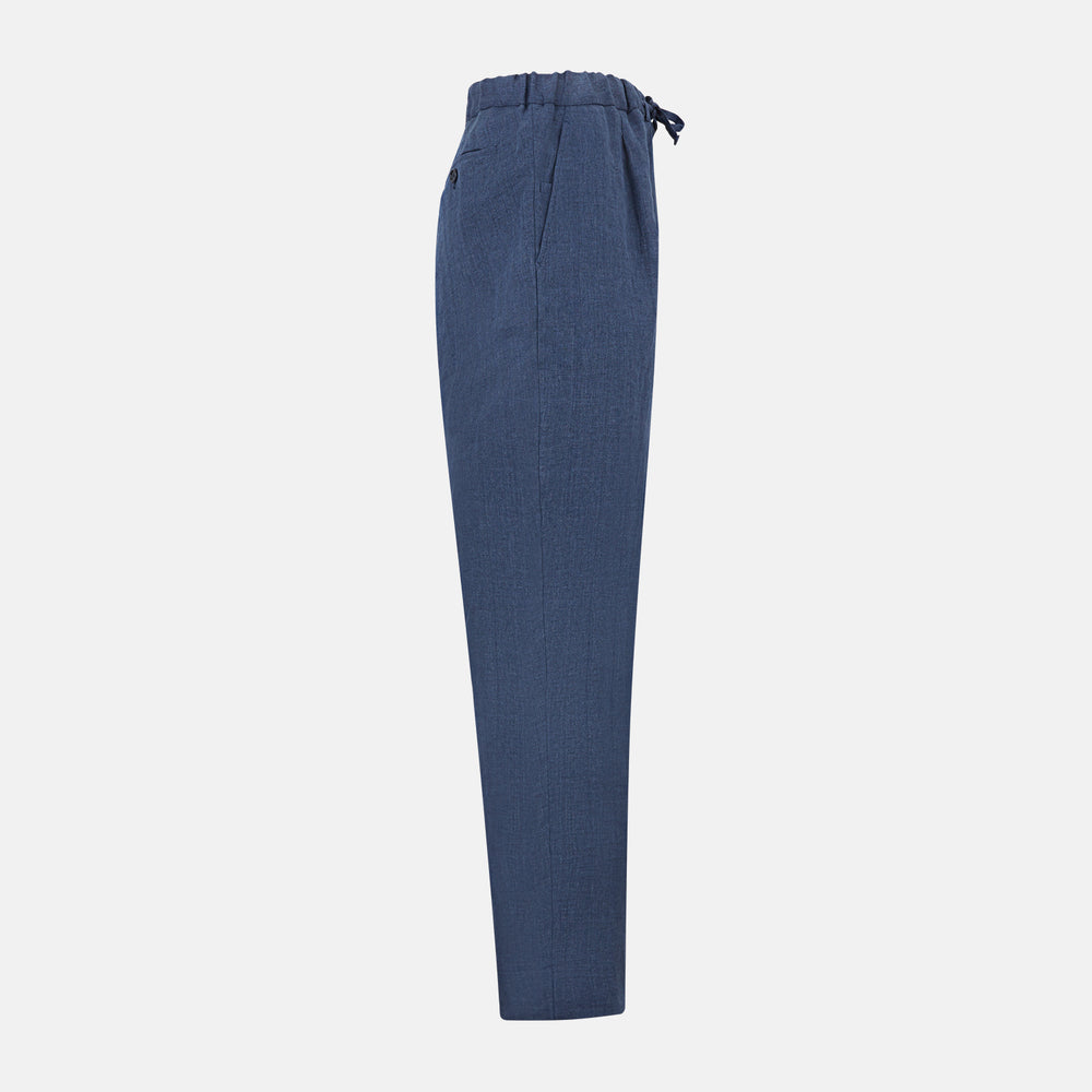 Turnbull & Asser Denim Blue Linen Herringbone Miles Trousers with a straight-leg fit, elasticated waist, and drawstring tie, shown against a plain white background.
