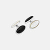 View 1 of product Turnbull & Asser's Reversible Monochrome Sterling Silver Oval Cufflinks feature polished frames with one black onyx side and one white mother-of-pearl side—an elegant luxury gift shown on a plain white background.
