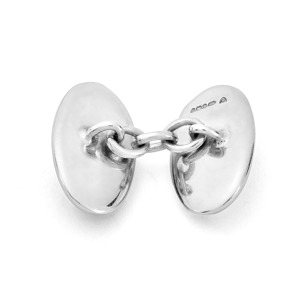 Turnbull & Asser's Reversible Monochrome Sterling Silver Oval Cufflinks feature polished frames with one black onyx side and one white mother-of-pearl side—an elegant luxury gift shown on a plain white background.