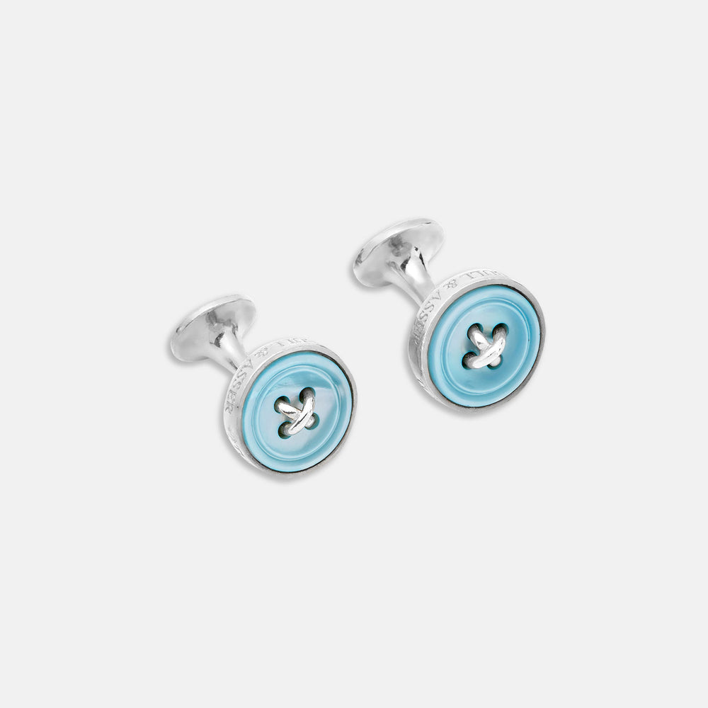 Turnbull & Asser Blue Sterling Silver Mother-of-Pearl Button Cufflinks feature a four-hole blue button design, crafted in sterling silver, displayed on a white background.