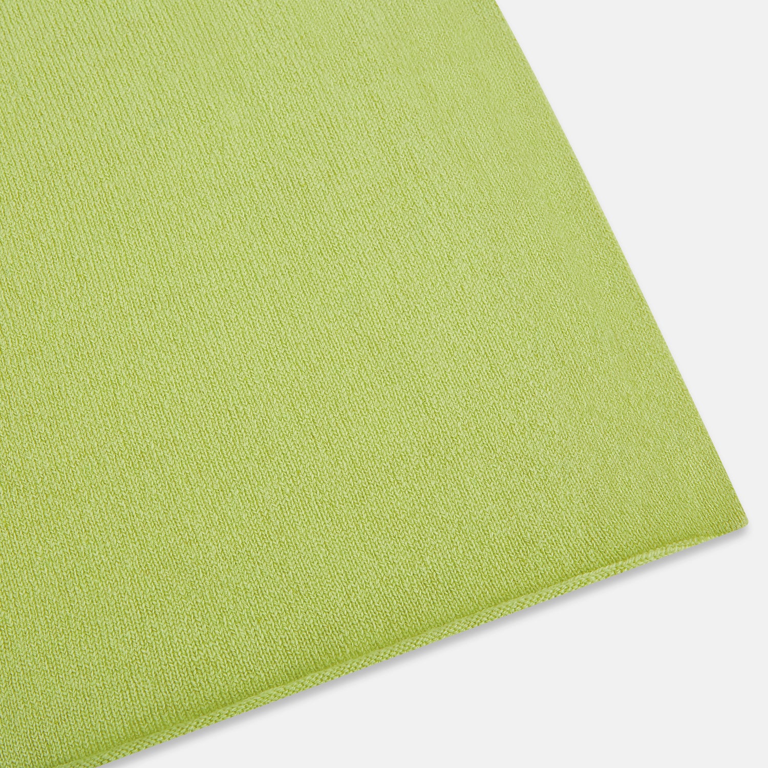 Image 2 of product The Plain Canary Yellow Cashmere Knitted Scarf from Turnbull & Asser is a soft, premium accessory, elegantly draped against a white background—an essential addition to any wardrobe.