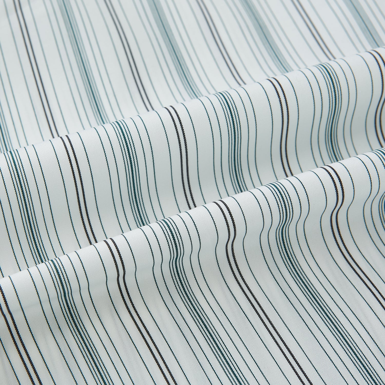 View 8 of product A Forest Green Multi Stripe Westminster Shirt by Turnbull & Asser, featuring thin green stripes on white and expert British craftsmanship, is neatly laid flat with visible cuffs.