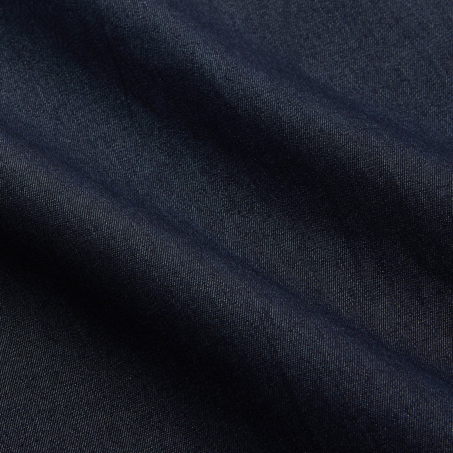 View 4 of product The Turnbull & Asser Navy Weekend Fit Larkin Shirt features a Dorset collar, long sleeves with 3-button cuffs, two chest pockets, and white snaps, shown laid flat against a white background.