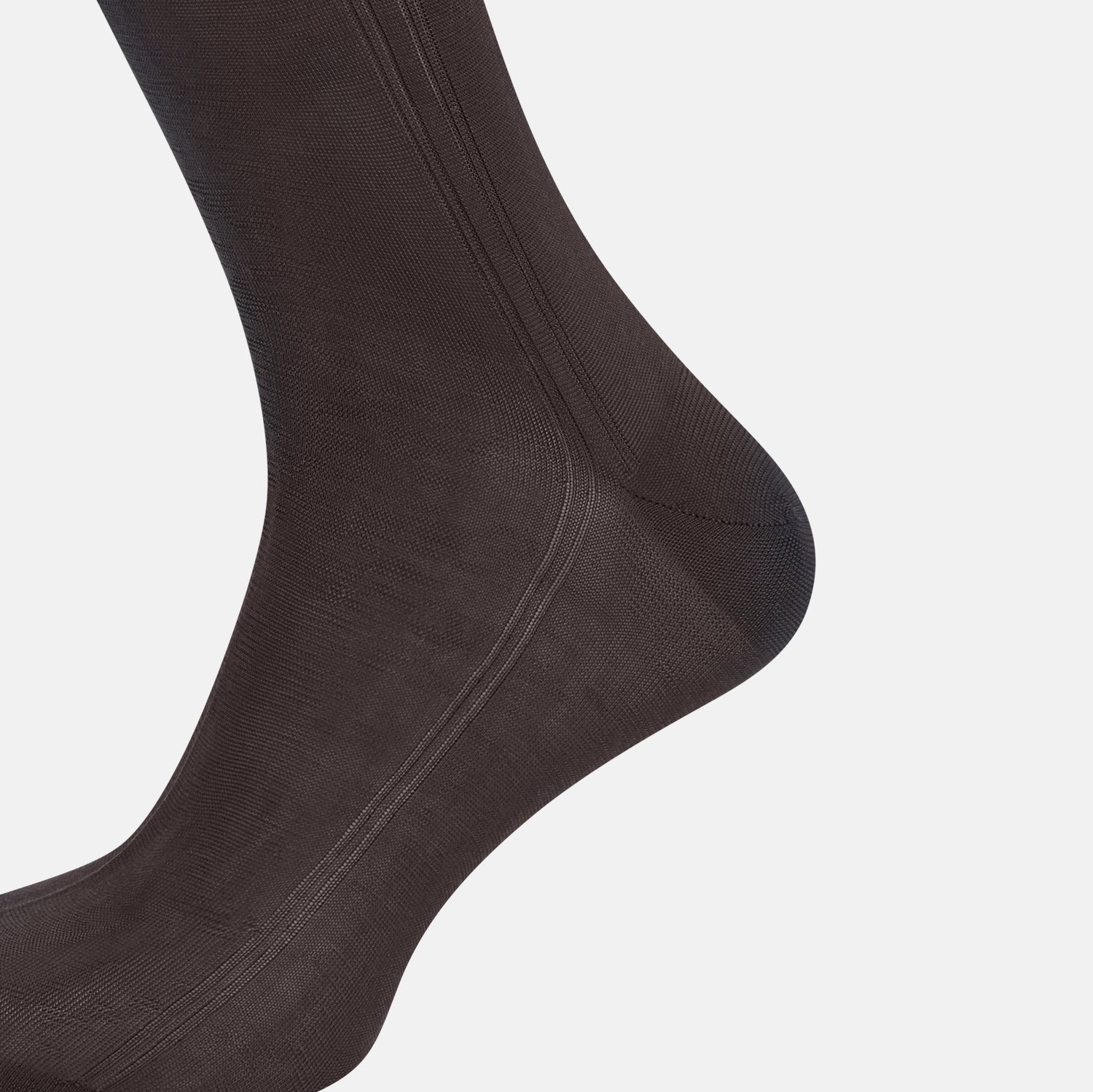 View 4 of product A single Sage Silk Long Sock by Turnbull & Asser, in black, is displayed from a side angle against a plain white background.