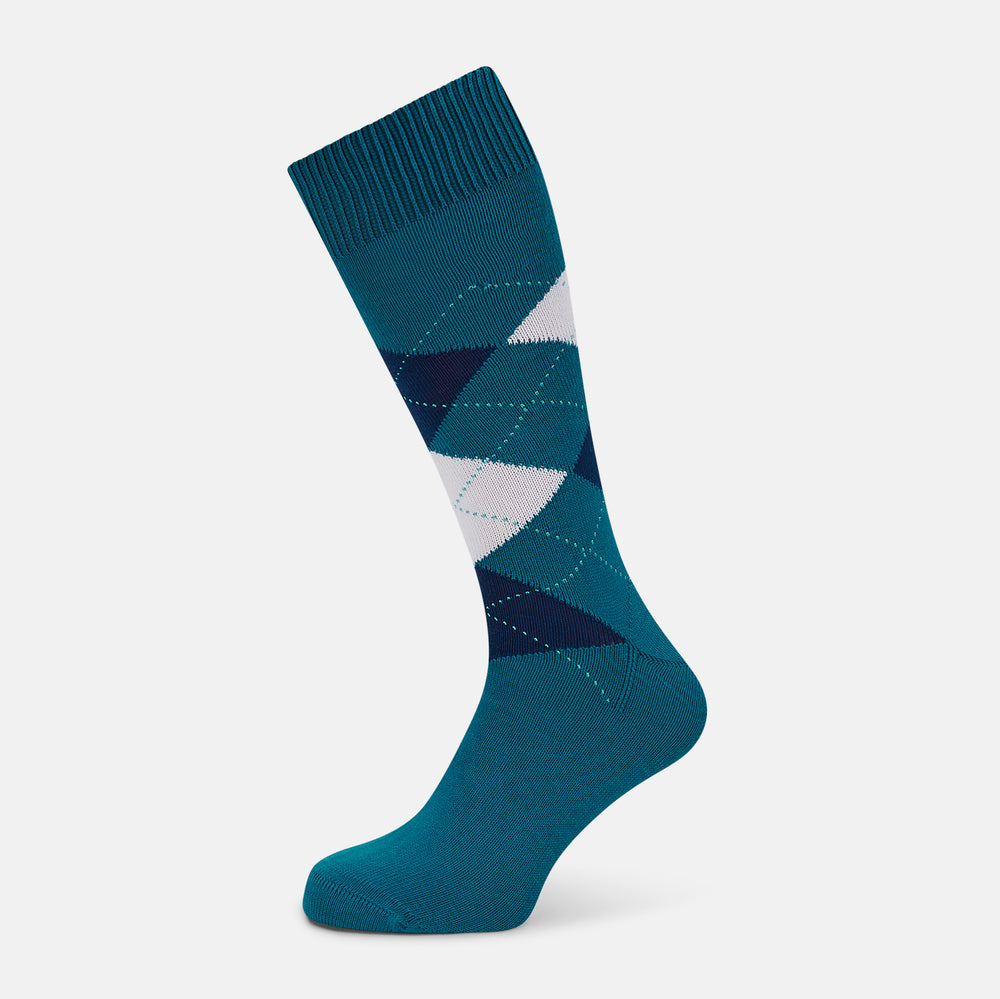 The Turnbull & Asser Azzurro Check Mid-Length Socks feature a classic argyle pattern in navy, white, and dark teal on teal cotton, with ribbed tops for a polished look and added comfort.