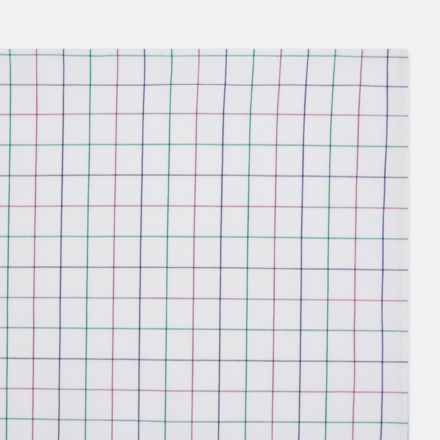 View 2 of product The Turnbull & Asser Hand Rolled Pink and Green Grid Check Handkerchief is a refined accessory, featuring a pink and green grid pattern—perfect for subtly enhancing any gentleman’s outfit.