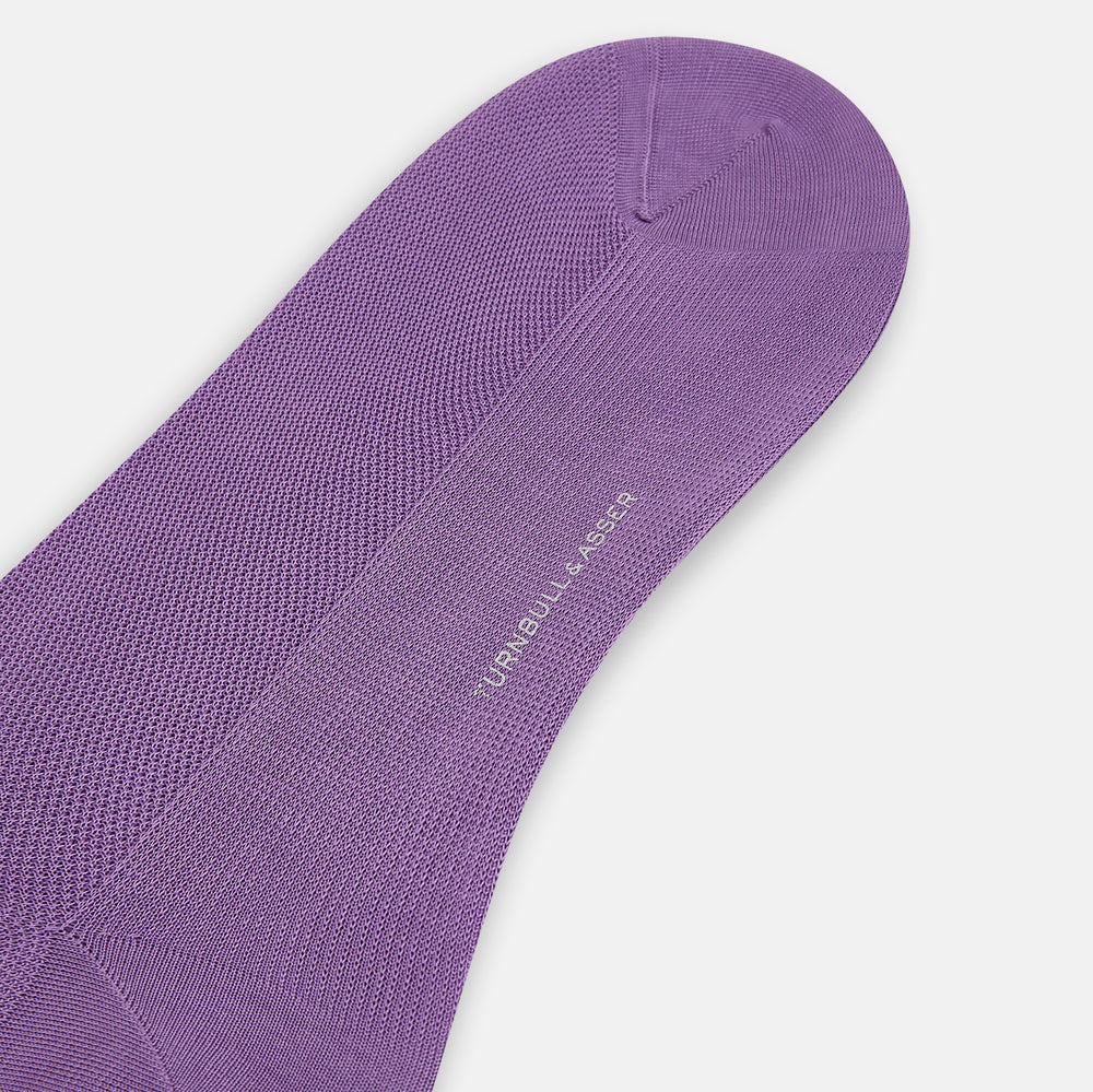 Turnbull & Asser’s Violet Micro Knit Mid-Length Sock, crafted from mercerised Egyptian cotton, stands upright on a plain white background with the toe and heel clearly visible.
