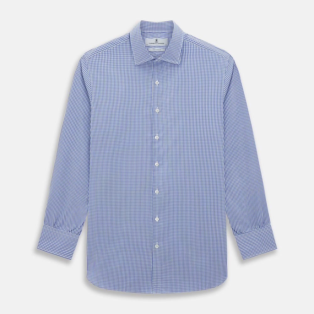 The Turnbull & Asser Blue Grid Check Belgravia Shirt, made from pure cotton with long sleeves, a spread collar, buttoned cuffs, and a blue-and-white check pattern, is laid flat on a white background.