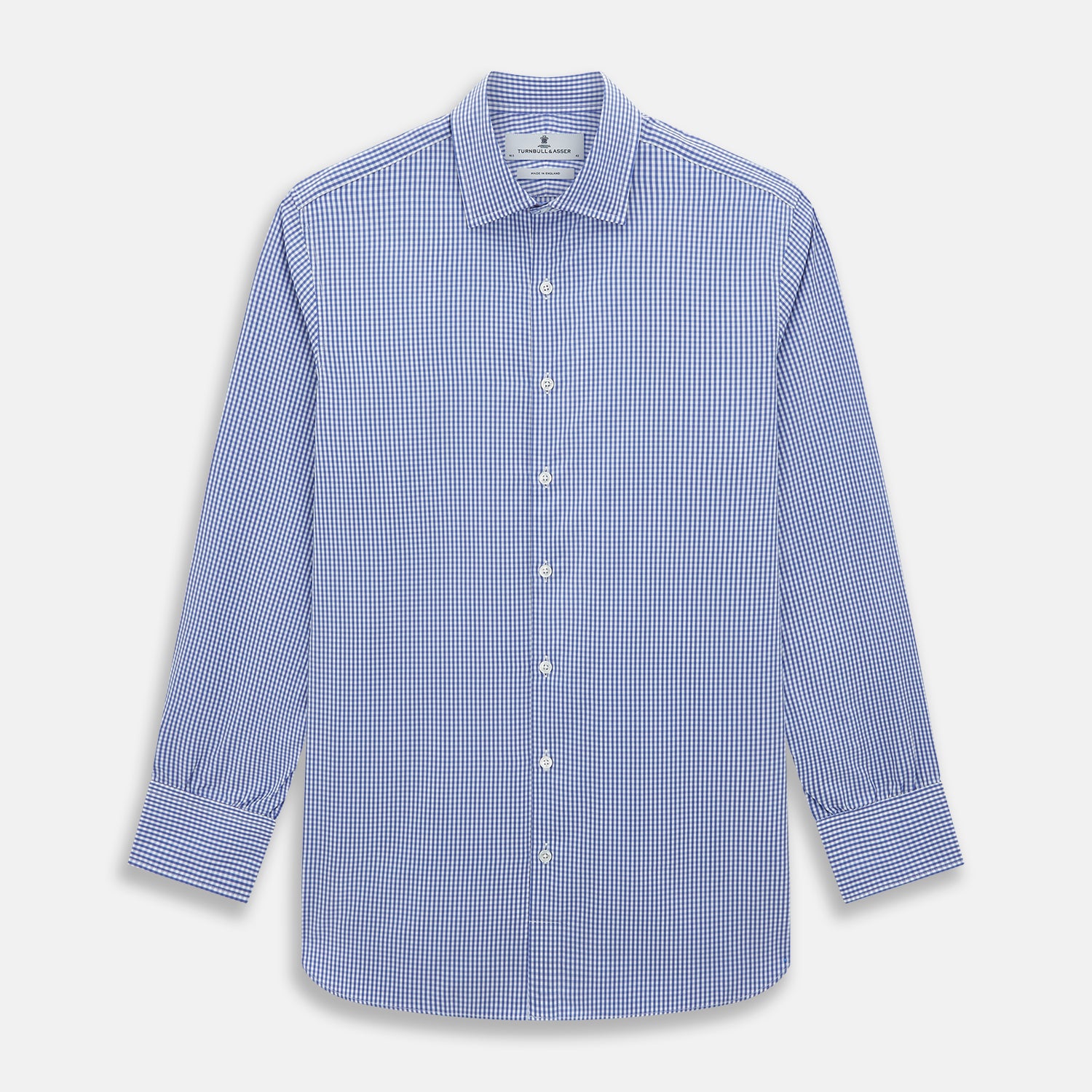 View 1 of product The Turnbull & Asser Blue Grid Check Belgravia Shirt, made from pure cotton with long sleeves, a spread collar, buttoned cuffs, and a blue-and-white check pattern, is laid flat on a white background.