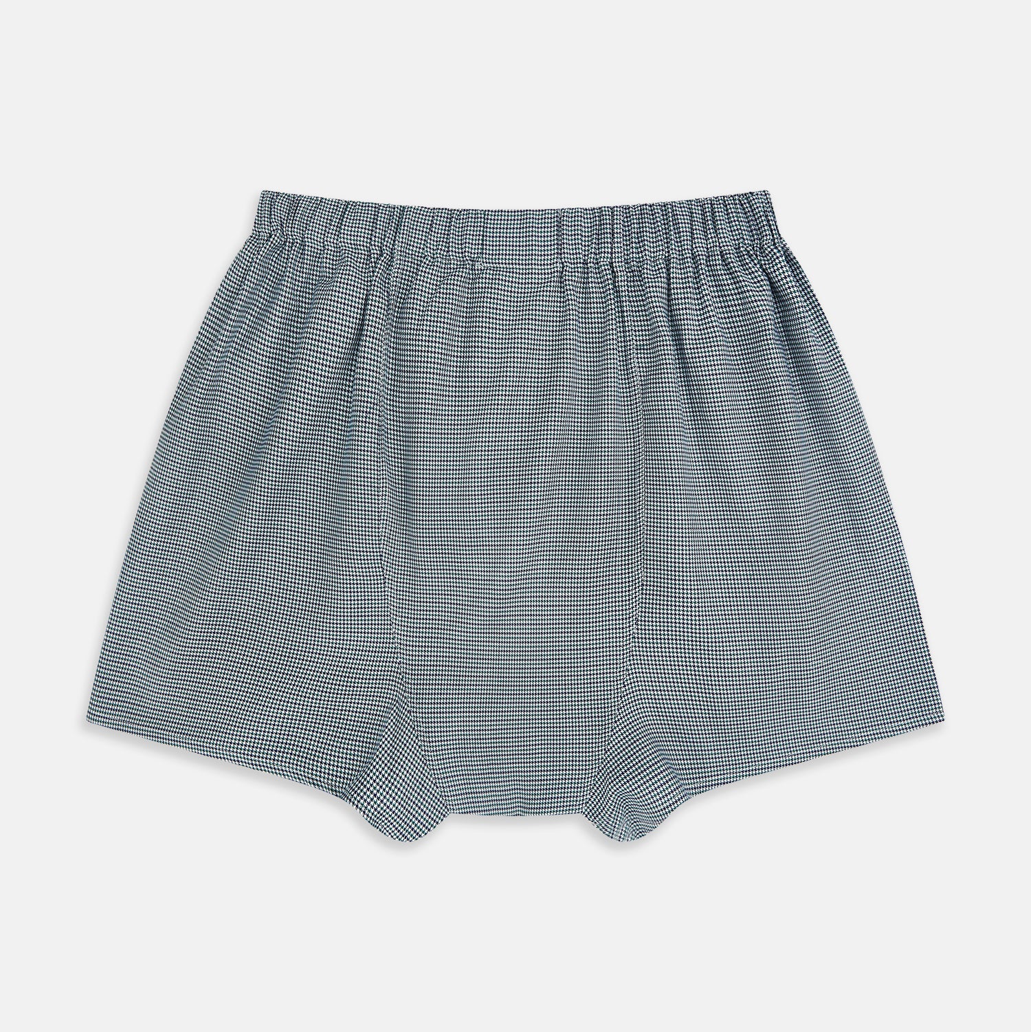 View 2 of product Turnbull & Asser Green Houndstooth Godfrey Boxer Shorts with an elastic waistband, showcasing a small black and white houndstooth pattern, are laid flat on a white background.