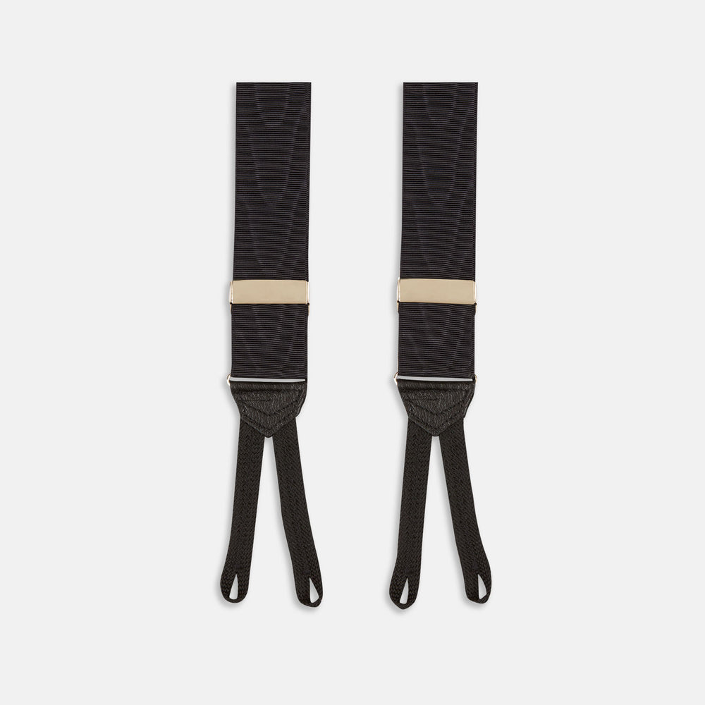 Turnbull & Asser Black Adjustable Formal Braces featuring leather ends and beige metal adjusters, made in England, shown on a white background.