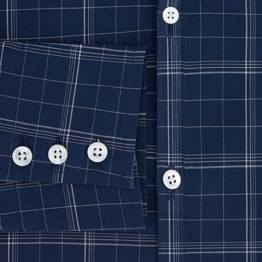 The Indigo and White Thin Plaid Check Windsor Shirt by Turnbull & Asser, a long-sleeve button-up with white buttons, is shown laid flat on a white background.